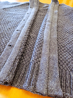 Steek edges covered with an Inkle band woven with the same yarn.