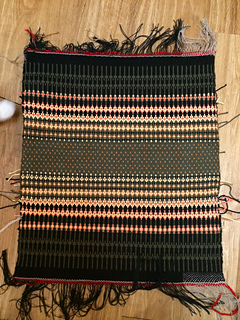 My textile tester can't wait to get his big white paws on this one. 

I should have counted squares on the graph. The sections came out to roughly the same length. Would be a more interesting design if they were different lengths. 