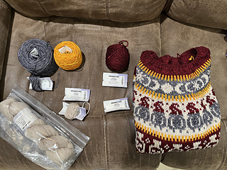 Finished sweater and yarn used/left
