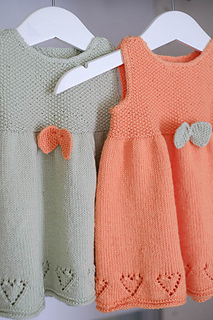 Knitted dress for baby. Image.