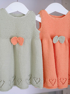 Knitted dress for baby. Image.