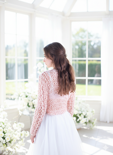 bride in a light room looking out of the window
