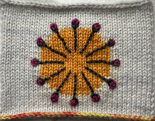 Swatch with intarsia and embroidery after rinsing away the Stick n Stitch