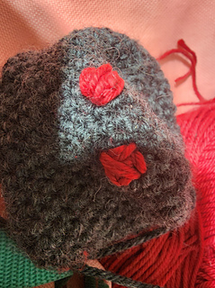 A close-up of an in-progress Mothman's embroidered on eyes 