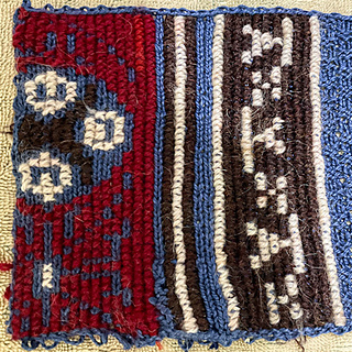 Finished, washed in lukewarm water with just a few drops of dish soap, and pinned out to dry. Not nearly as stretched as when I was stitching on it.