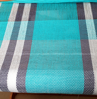 White weft complete, hems with divider and turquoise weft second towel.