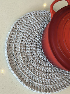 The perfectly round potholder doubles up as a trivet or...