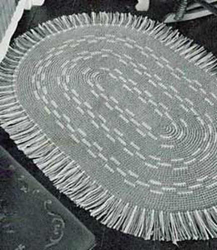The Gray and White Oval Rug photo 1