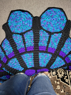 Two heptagons attached ... hmmm it looks like a Jean-Paul Gaultier bustier :thinking_face: