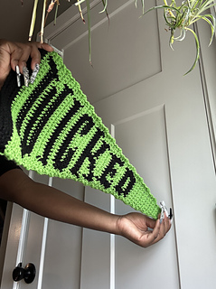 Person holds Wicked pennant