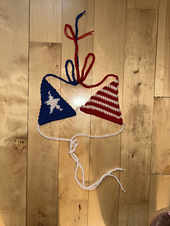 USA flag bikini lies on a wooden surface