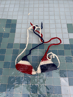 Flag bikini floats in a pool
