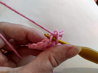 Making an invisible decrease: pick up the front loop of the first stitch you are decreasing from.