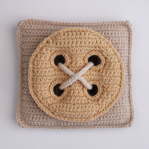 Base for sewing on a button