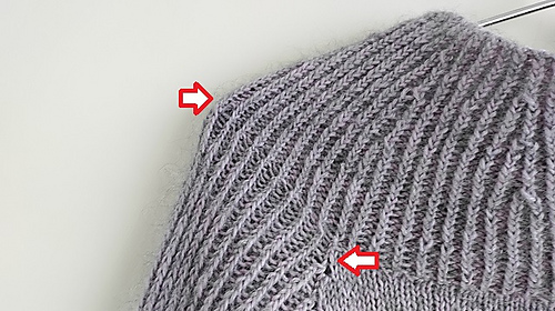 twisted stitches which occured in the ribbing pattern after using the winding CO 