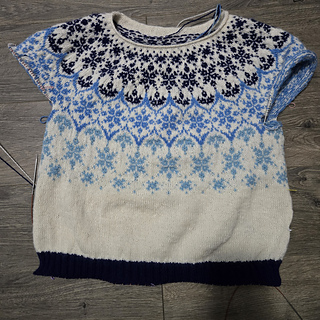 Picture of sweater before ripping back. I am rethinking the darker hem. I might consider the lightest blue. 