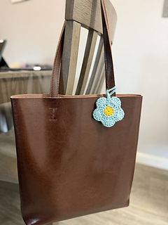 Crochet flower used as bag charm