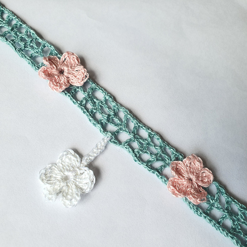 Light Green crochet lace strip, Simple Summer Sash, worked in fine thread as a choker, appliquéd with pink and white flowers (shown laid flat0.