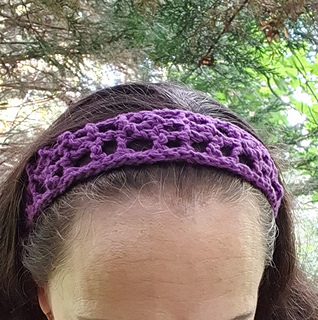 Purple crochet lace strip, Simple Summer Sash, worn by a woman as hairband (close-up)