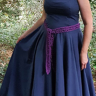 Purple crochet lace strip, Simple Summer Sash, worn by a woman as belt.