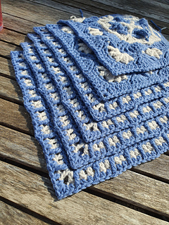 blue and grey crocheted fancy granny square stack