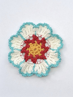 set of six crocheted yellow, red white and turquoise flower coasters