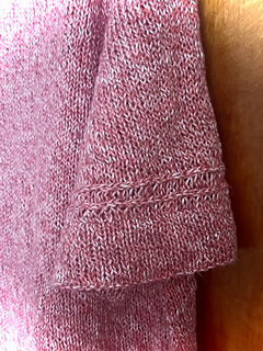 Sleeves with paired lateral braids and folded cuffs