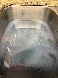 I soak my knitted goods with Tuft Woolens sock soap. :soap:
