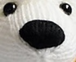 Knitted nose on the design bear