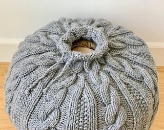 The opening with the tie at the bottom