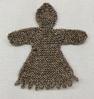 Gingerbread Woman with lacy hem. Sock weight yarn.