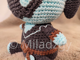 Thresh from League of Legends, crochet toy made by amigurumi technique.  Used dark grey, turqoise and brown yarn. Collar and its lining detail view.