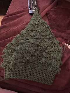 This is a finished child sized hat made with size I (5.5mm) laying down