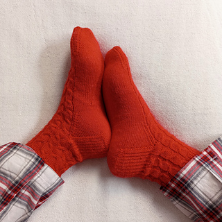Ravelry: One More Cable Socks pattern by mdesco