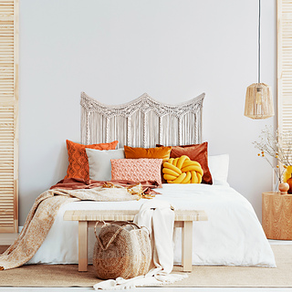 Photo of orange bedroom by Photographee.eu and available from Shutterstock, Photoshopped by Erin Black.