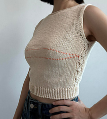 Contrasting yarn used to mark the bust dart area on the sample, removed it before washing