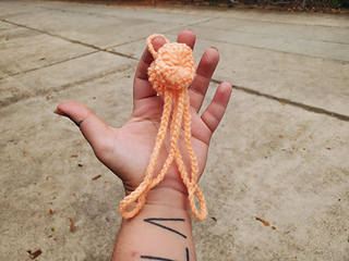 Holding my completed Shower Sandal Holder with no sandals attached.