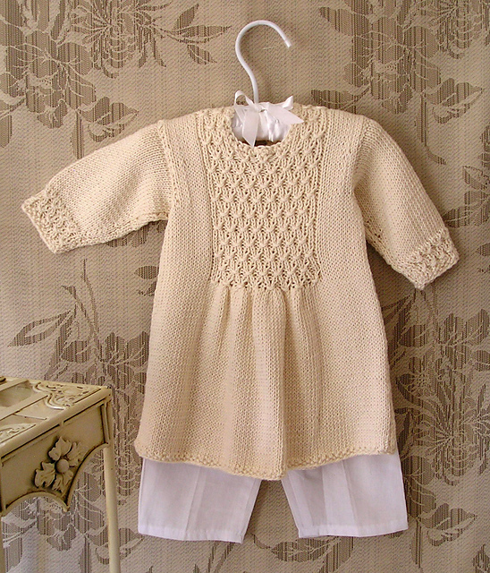 Ravelry Baby girls smocked front panel dress P006 pattern by OGE Knitwear Designs