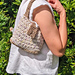 Crochet cotton mini baguette shoulder bag with raffia base and flap 