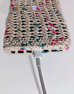 Crochet phone wristlet with openings for charging ports