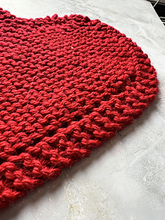 close up image of garter sts and eyelets.