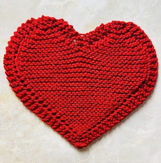 a full image of a heart-shaped dishcloth looking lovely in red color. Perfect for Valentine's Day!
