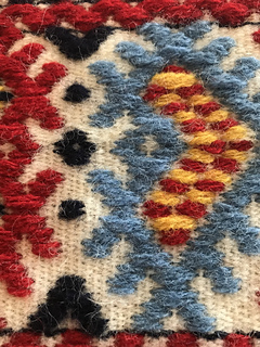 closeup of front. Original done with white linen, mine is wool.