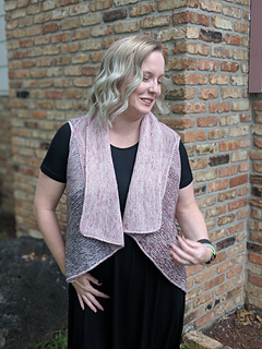Susie typically knits herself size 42“ garments, and for this project, she made the Size 1. She’s shown here modeling
the garment with just a touch of negative ease.