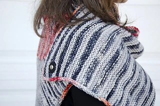 This shows the back shoulder of the styling with the poncho worn as a dress. This is the pedestal-style removable button.