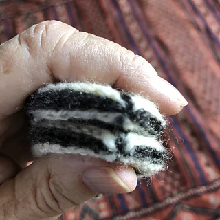 Each mitten finishes with a tiny two color rosebud tip