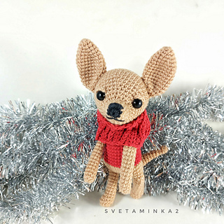 Chihuahua dog in a stylish fake vest for a cozy everyday look.