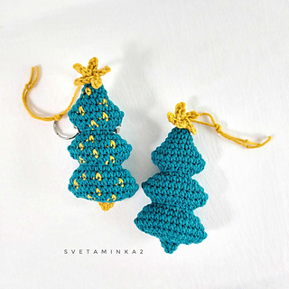 Two crocheted Christmas trees with a cute little 'star' for the final touch. Pattern includes photos for easy crafting.