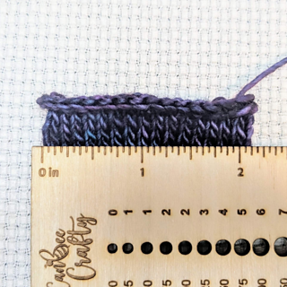 Gauge swatch in the round.  

30 sts, 10 rounds

2 1/8" width, 7sts/in