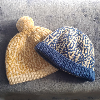 Left: short brim and pompom.
Right: folded brim, no pompom.